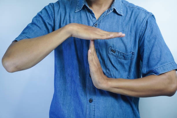 istock Businessman showing hand sign ,pause or request a break ,time out gesture sign ,time for a break ,Gestures asking for time to consult or clarify 1834867694