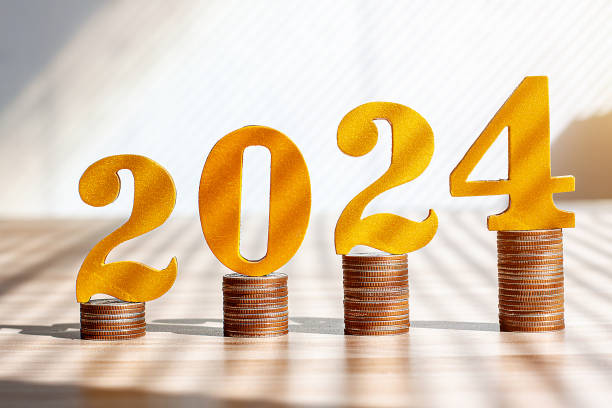 istock Putting number 2024 on the stack of coins 1834881626