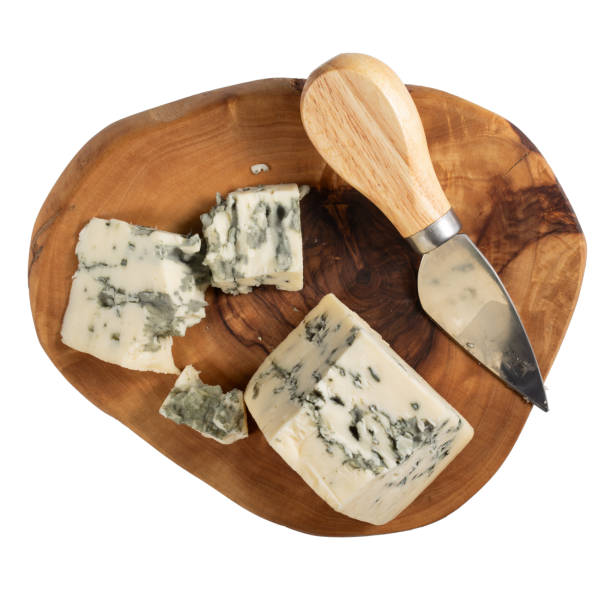 istock Blue cheese on wooden cutting board isolated on white background.  Top view. 1834891547