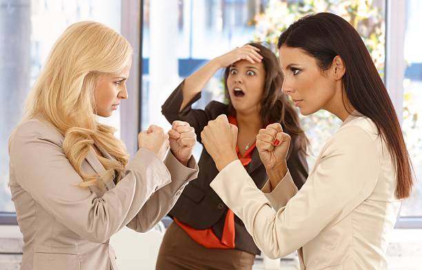 istock Determined businesswomen fighting at workplace 183489390