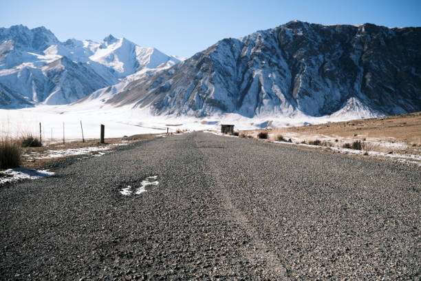 istock Empty road in winter mountain gorge 1834901218
