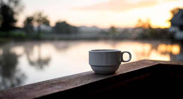 istock Hot coffee cup  on the wooden table and the blurred background with copy space for your text 1834922835