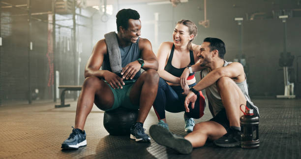 istock Fitness, group and conversation in gym with confidence, workout and exercise class. Diversity, friends talk and wellness portrait of athlete with coach ready for training and sport at a health club 1834928389