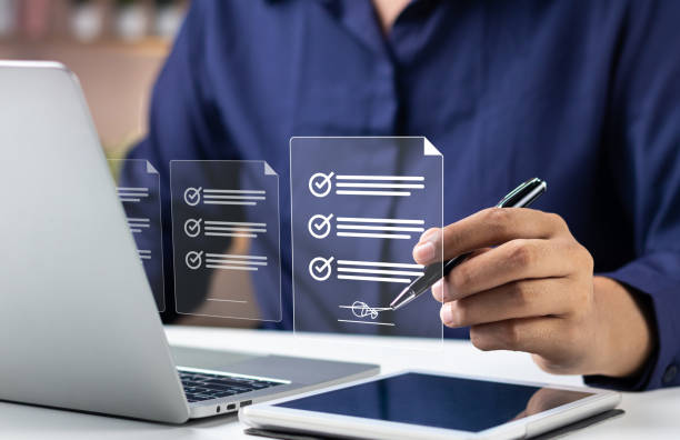 istock Efficient Electronic Signature Concept, Businessman using stylus pen signs electronic documents on digital documents on virtual tablet. Signing electronic documents for paperless transactions. 1834950461