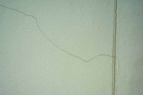 istock Cracked concrete building broken wall or pole outside house 1834950465
