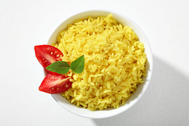istock Looking down at a bowl of yellow rice dish 183495414