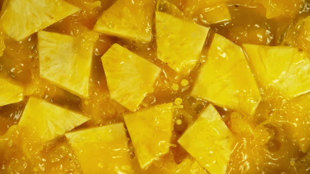 Super Slow Motion Shot of Flying Pineapple Slices