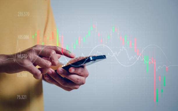 istock Women use smartphones to analyze trading data on the futuristic virtual interface screens.strategy planning business goals. 1834971206