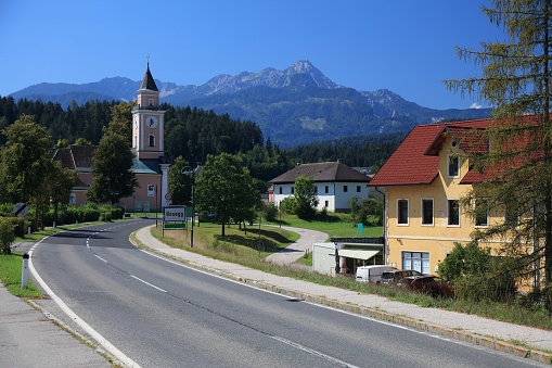 Rosegg town in Austria. Small town in Carinthia state. Karawank Alps mountains in background. Rosental region.