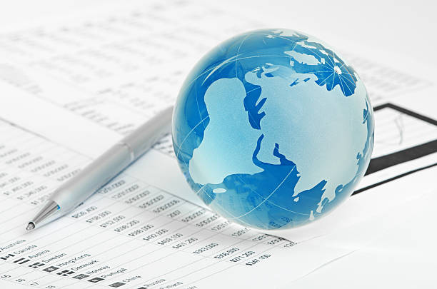 istock Glass globe and pen on finance 183498077