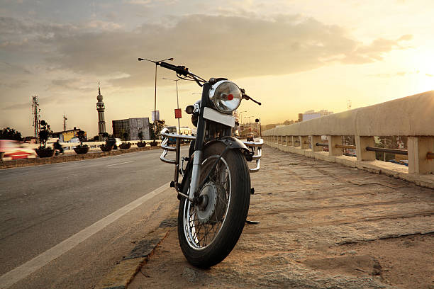 Motorcycle parked on road side and evening sky behind, Low angle shot.