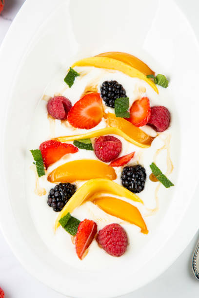istock fruit salad with wild berries and strawberries top view 1835002506