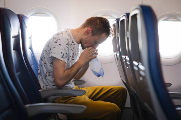 istock Young tourist feeling ill on the airplane while travelling 1835006852