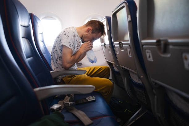 istock Young tourist feeling ill on the airplane while travelling 1835006854