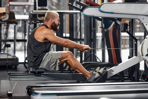 istock Training legs in the simulator, the athlete works with his legs on the simulator, working out the muscles on the legs 1835007396