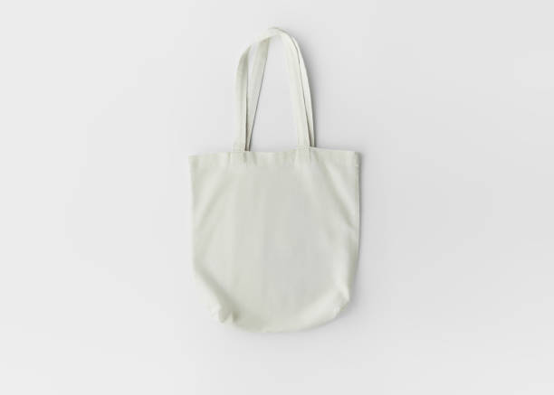 empty cotton eco friendly shopping bag on white background, top view