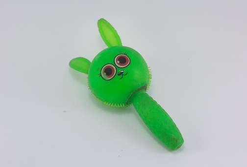cute green kid toy isolated at white background