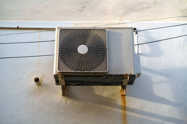 istock The air conditioner is mounted on a bracket attached to the building wall 1835038083
