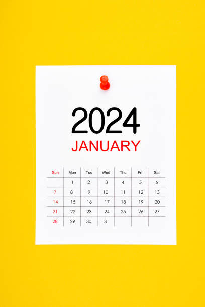 istock A January 2024 calendar page with push pin on yellow background. 1835041895