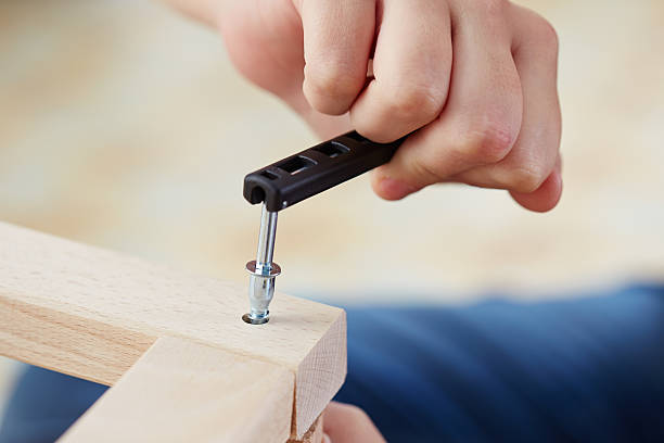 istock Hands assembling piece of furniture 183504412
