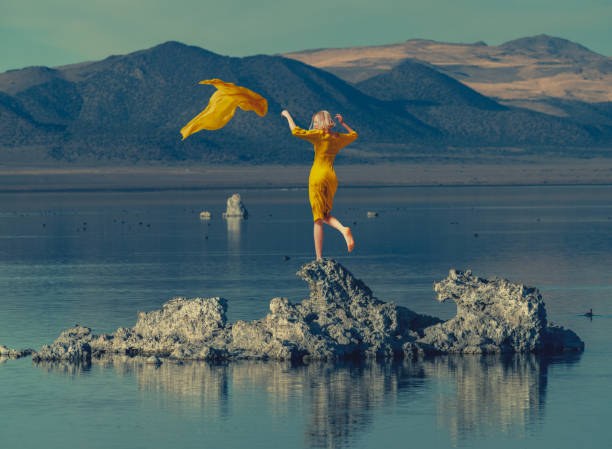 istock young beautiful woman at rocks 1835044636