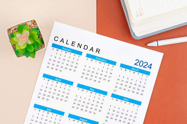 istock Calendar Year 2024 and pen with diary. 1835049479