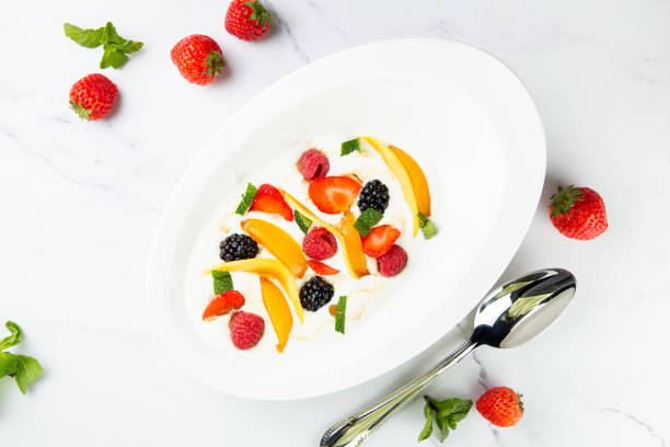 istock fruit salad with wild berries and strawberries side view 1835053802