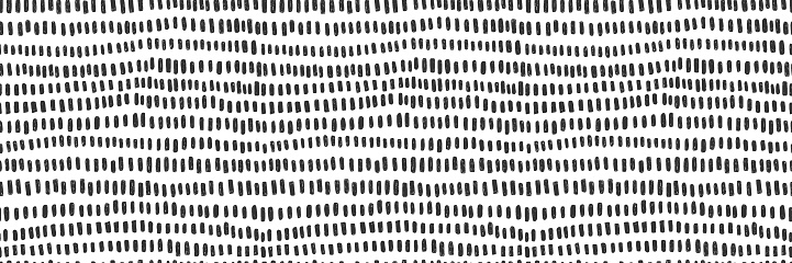 Hand drawn small dash seamless pattern. Black grunge doodle stroke on white background. Abstract vector wallpaper, print.