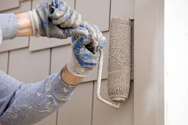 istock House Painter Roller Painting new Siding 183506636