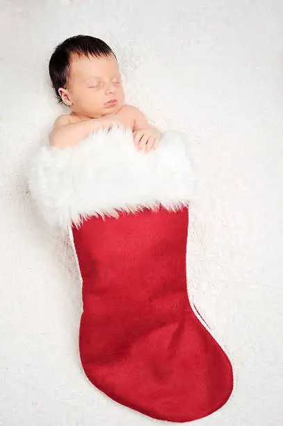 babyborn in a Christmas stocking. studio shot. Available with french text on the sock.Please this similar picture from my portfolio :