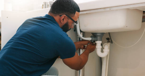 istock Plumber black man, kitchen and sink maintenance with tools, focus and pipe repair for drainage in home. Entrepreneur handyman, plumbing expert or small business owner in house for fixing water system 1835093706