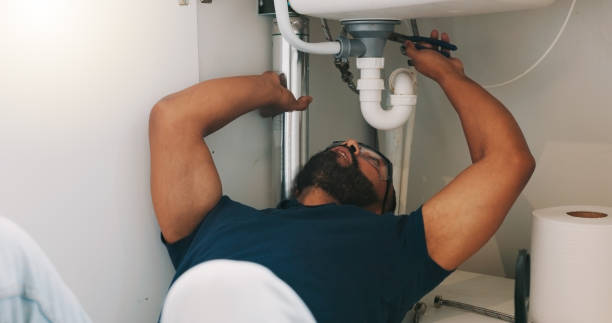 istock Plumber black man, kitchen and sink maintenance with tools, focus and pipe repair for drainage in home. Entrepreneur handyman, plumbing expert or small business owner in house for fixing water system 1835093717