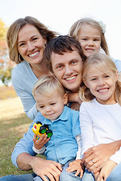 istock Close Family Smiling Together at a Park 183510607