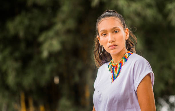 istock young woman with a very serious face while standing outdoors and looking to the side 1835116777