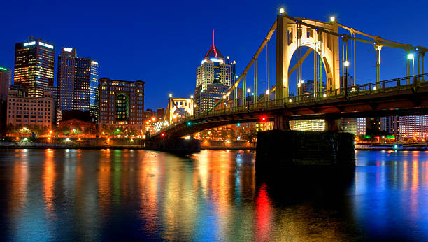 Pittsburgh Skyline At Night Pittsburgh skyline at night with light reflecting off the Allegheny River.  An HDR image from three exposures. sixth street bridge stock pictures, royalty-free photos & images