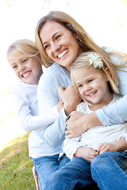 istock Mom With Her Daughters at a Park Together 183513678