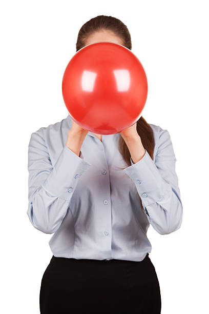 istock Girl holds red balloon inflated 183515768