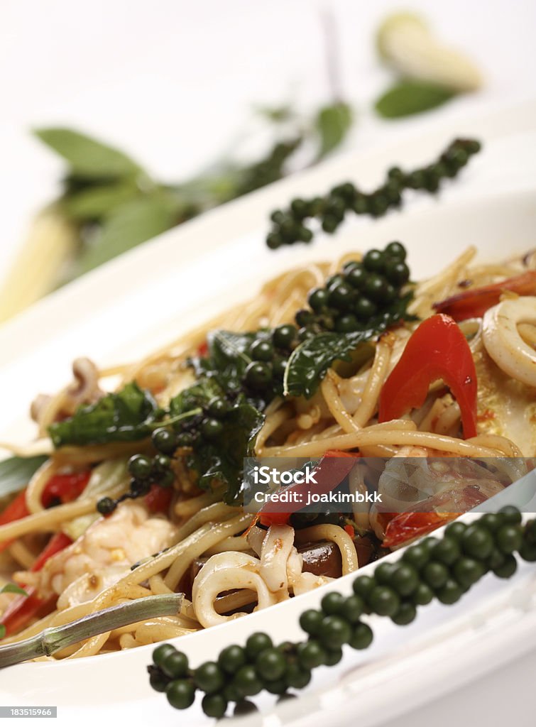 Thai spicy spaghetti seafood with green pepper "Thai fusion delicacy, with European spaghetti and spicy Thai seafood (studio shot).Further choices below:" Baby Corn Stock Photo