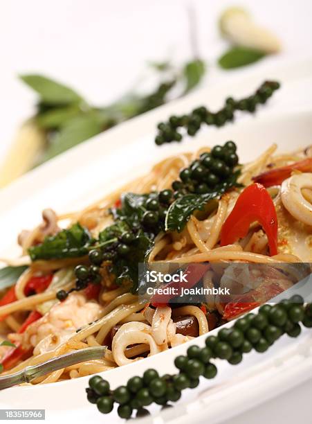 Thai Spicy Spaghetti Seafood With Green Pepper Stock Photo - Download Image Now - Baby Corn, Calamari, Chili Pepper