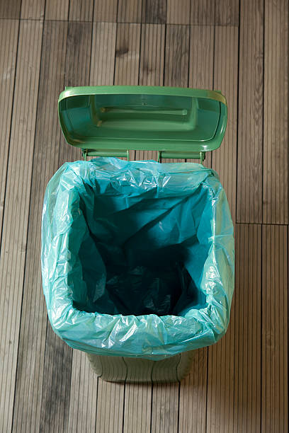 empty green trash can empty green trash can wastepaper basket photos stock pictures, royalty-free photos & images