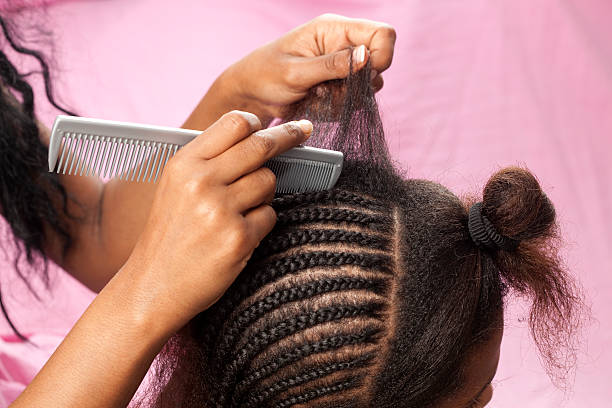 Hairstyle in process. Updo African hairstyle with hair extension. black woman hair extensions stock pictures, royalty-free photos & images