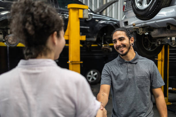 istock Customer greeting a mechanic in a car workshop 1835182393