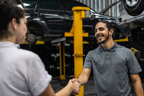 istock Customer greeting a mechanic in a car workshop 1835182395