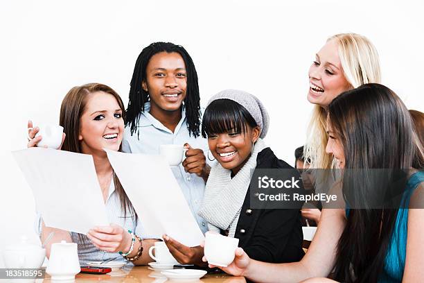 Group Of Young People Delighted By Documents Perhaps Exam Results Stock Photo - Download Image Now