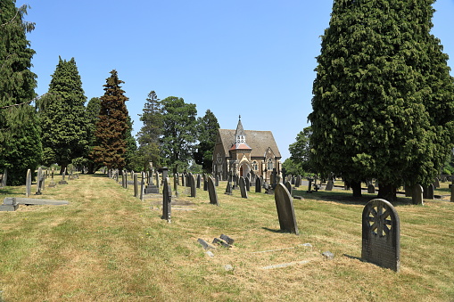 View of famous Old North Cemetery of Munich, Germany with historic gravestones. Funerals have not been held here since 1944. Instead, the cemetery is used as a park.