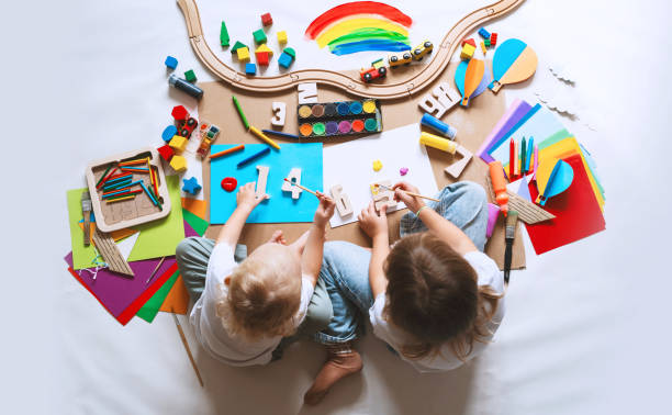 istock Children drawing and making crafts in kindergarten or daycare. 1835188979