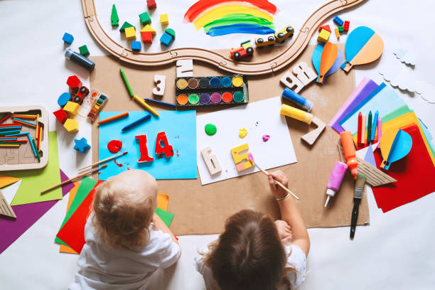 istock Children drawing and making crafts in kindergarten or daycare. 1835189140