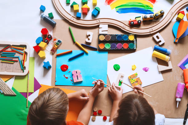 istock Children drawing and making crafts in kindergarten or daycare. 1835189559