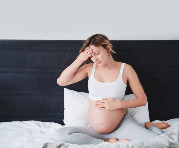 istock Pregnant woman suffering lower back pain, headache, sick. 1835193861