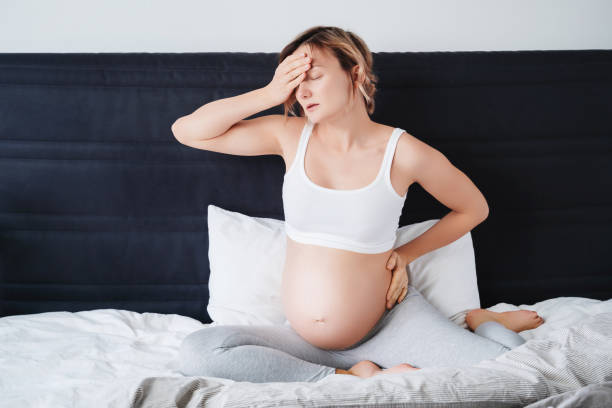 istock Pregnant woman suffering lower back pain, headache, sick. 1835193871